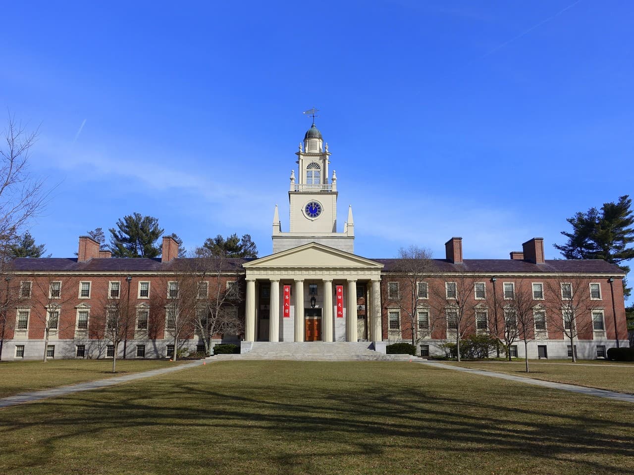 Samuel Phillips Hall, a brick building with white columns and a clock tower topped by a cupola, at Phillips Academy Andover