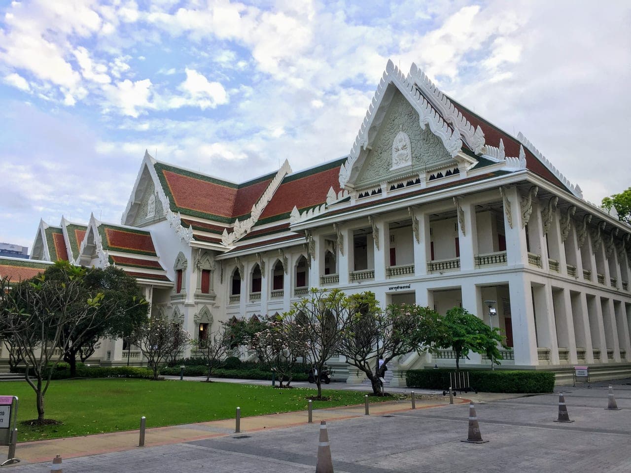 The Maha Chulalongkorn Building at Chulalongkorn University in Bangkok, a white building with tiered Thai roofs