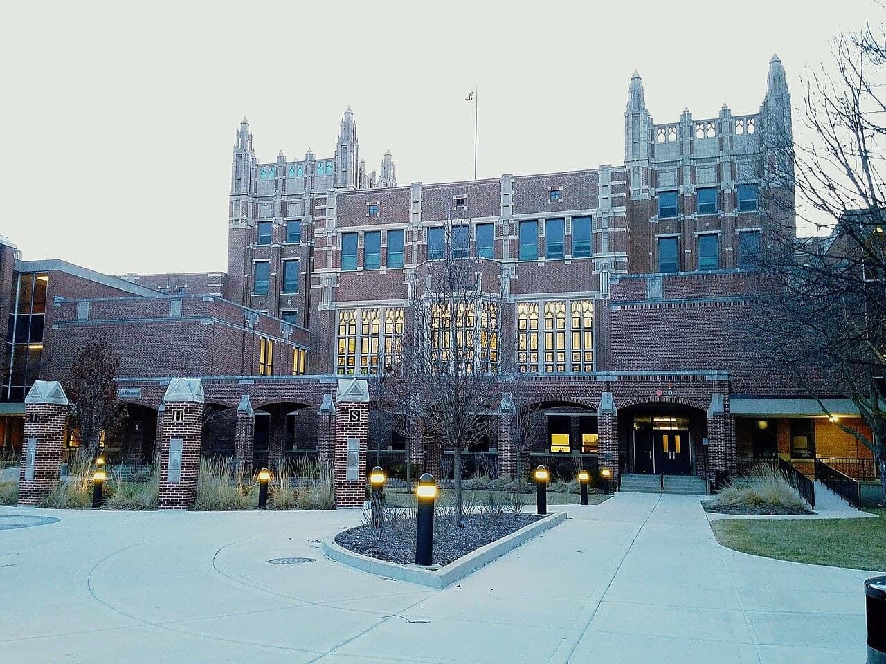 The towers and lit entrances of Evanston Township High School in Illinois.