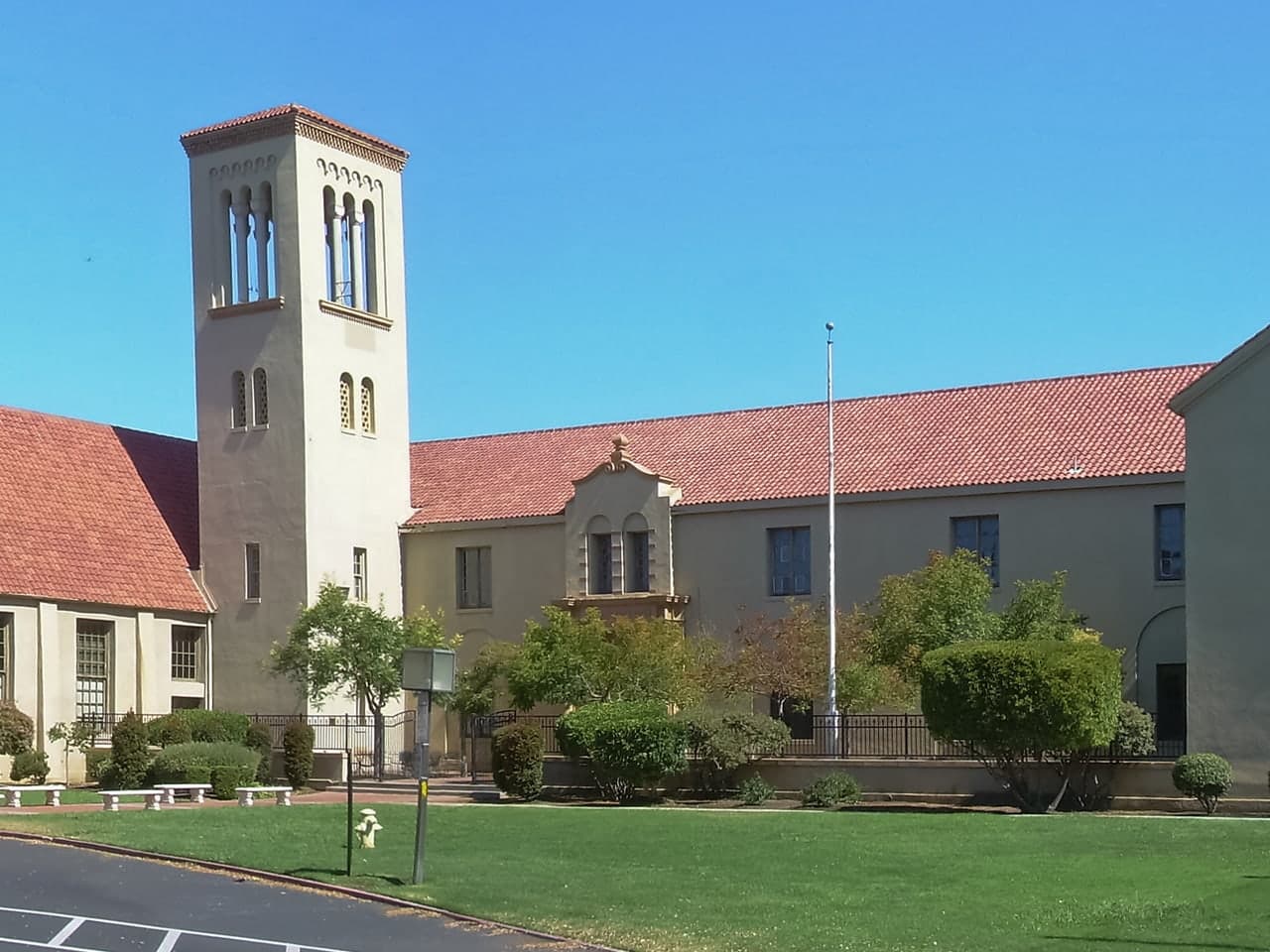 The bell tower, red roof, and lawn at Palo Alto High School in California.